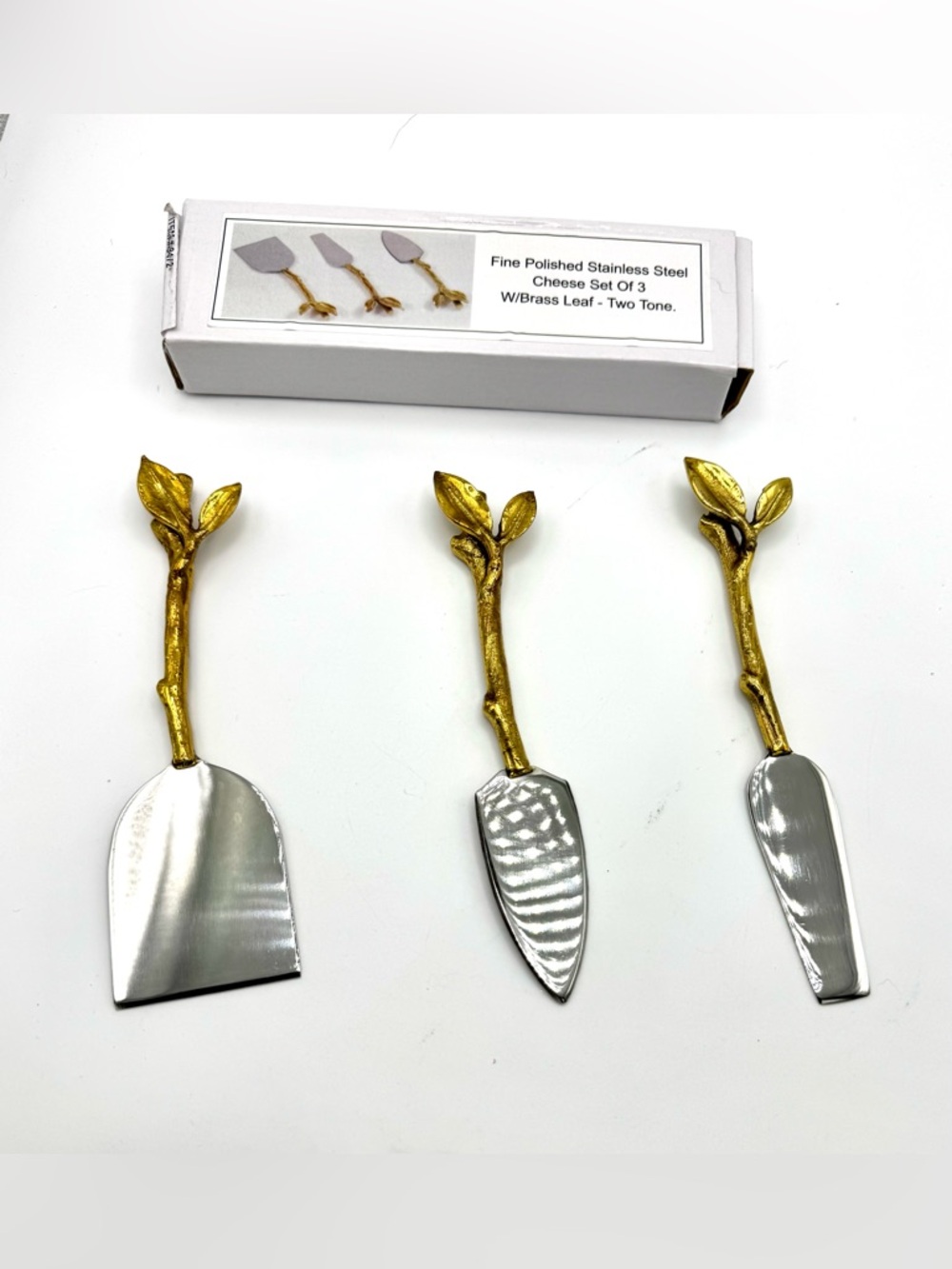 New Polished Stainless Steel
3 Cheese Knives 
W/Brass Leaf - Two Tone.